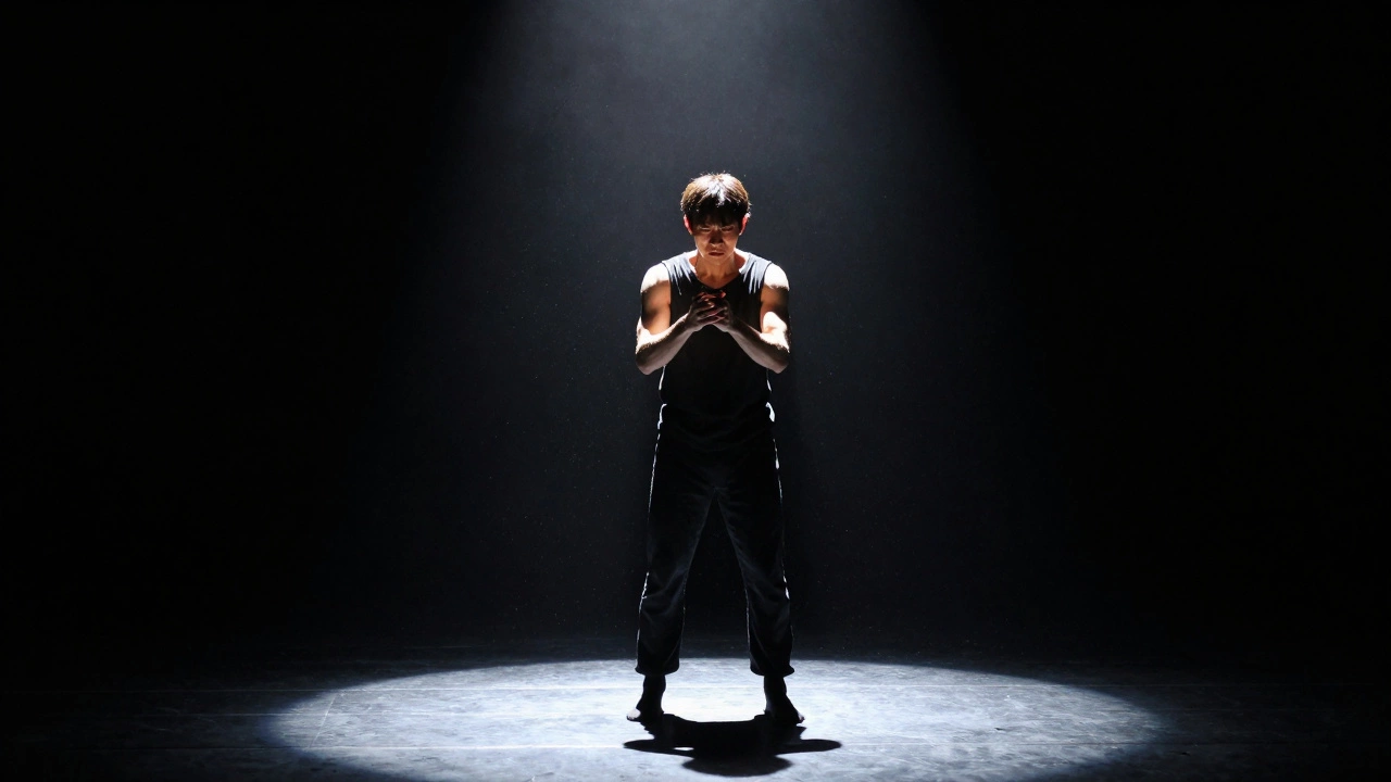 Spotlit performance artist expressing emotion on a dark stage